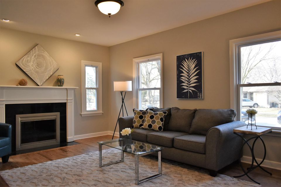 A living room with a couch and a fireplace