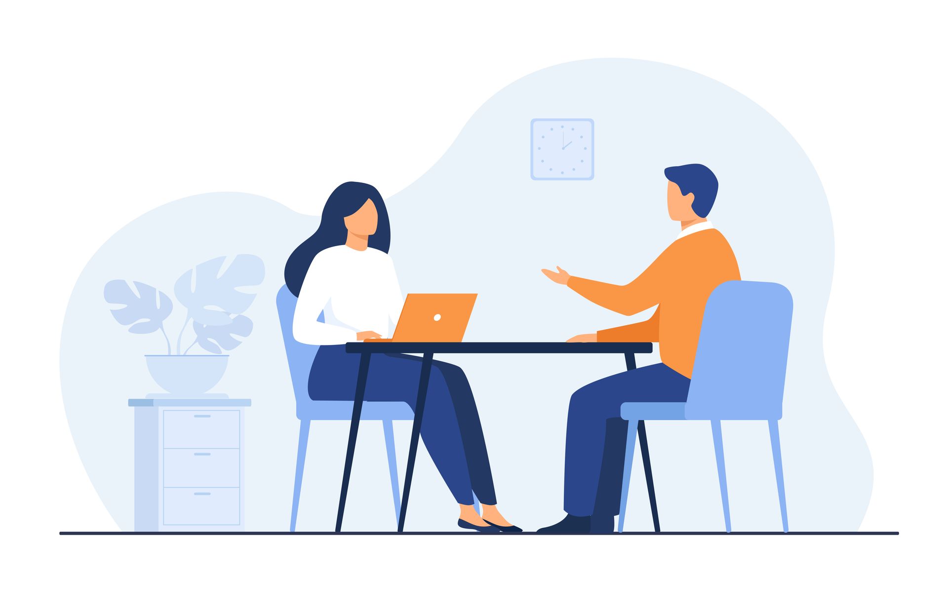 A man and a woman are sitting at a table having a conversation.