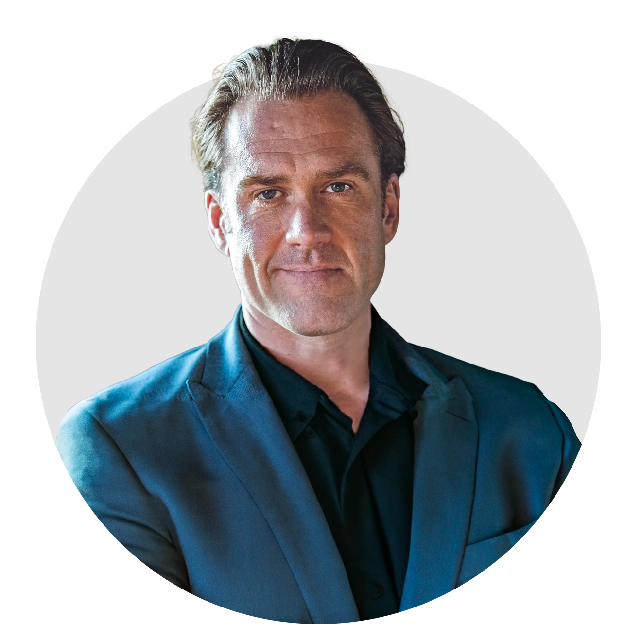A man in a blue suit and black shirt is in a circle.