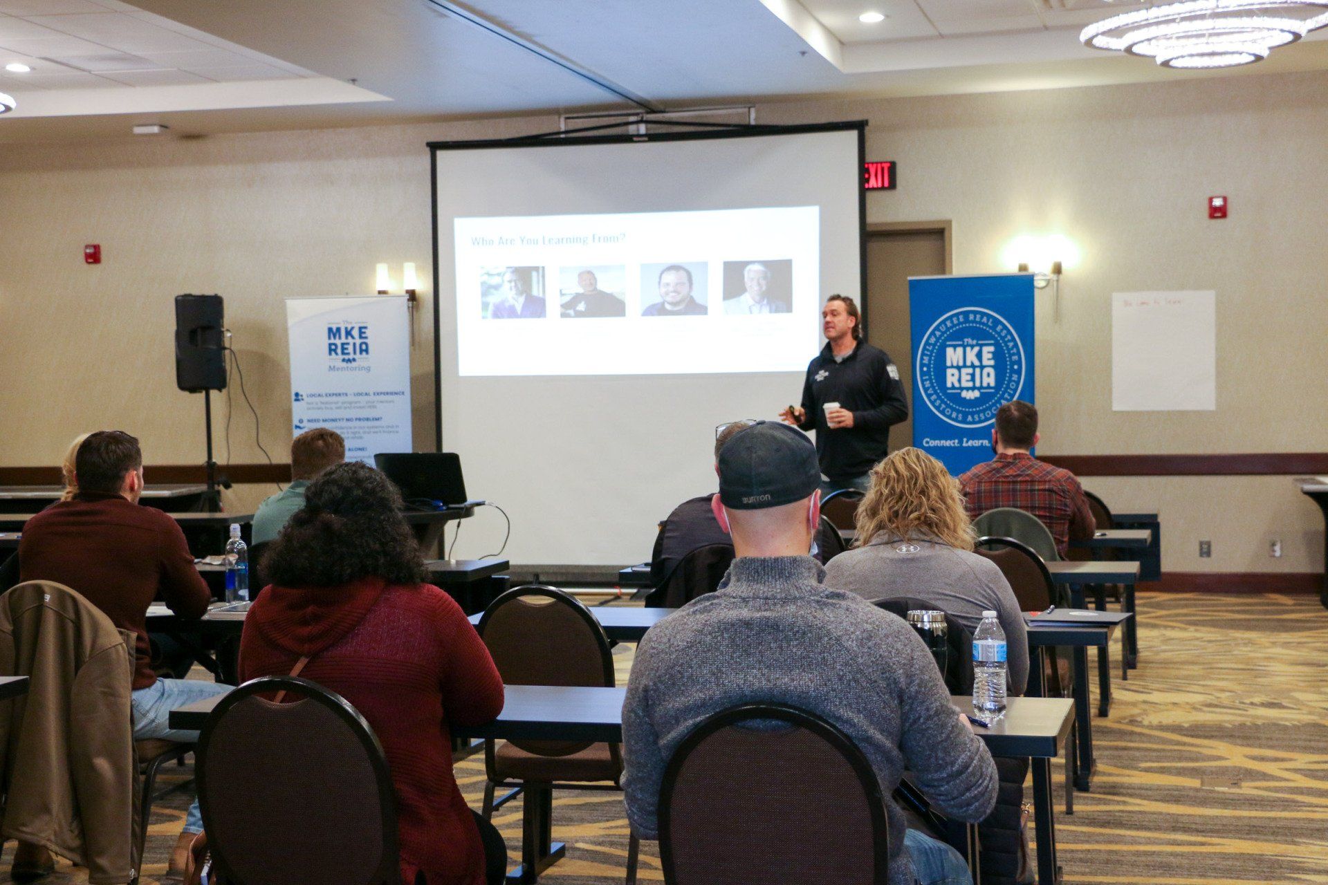 A man is giving a presentation to a group of people
