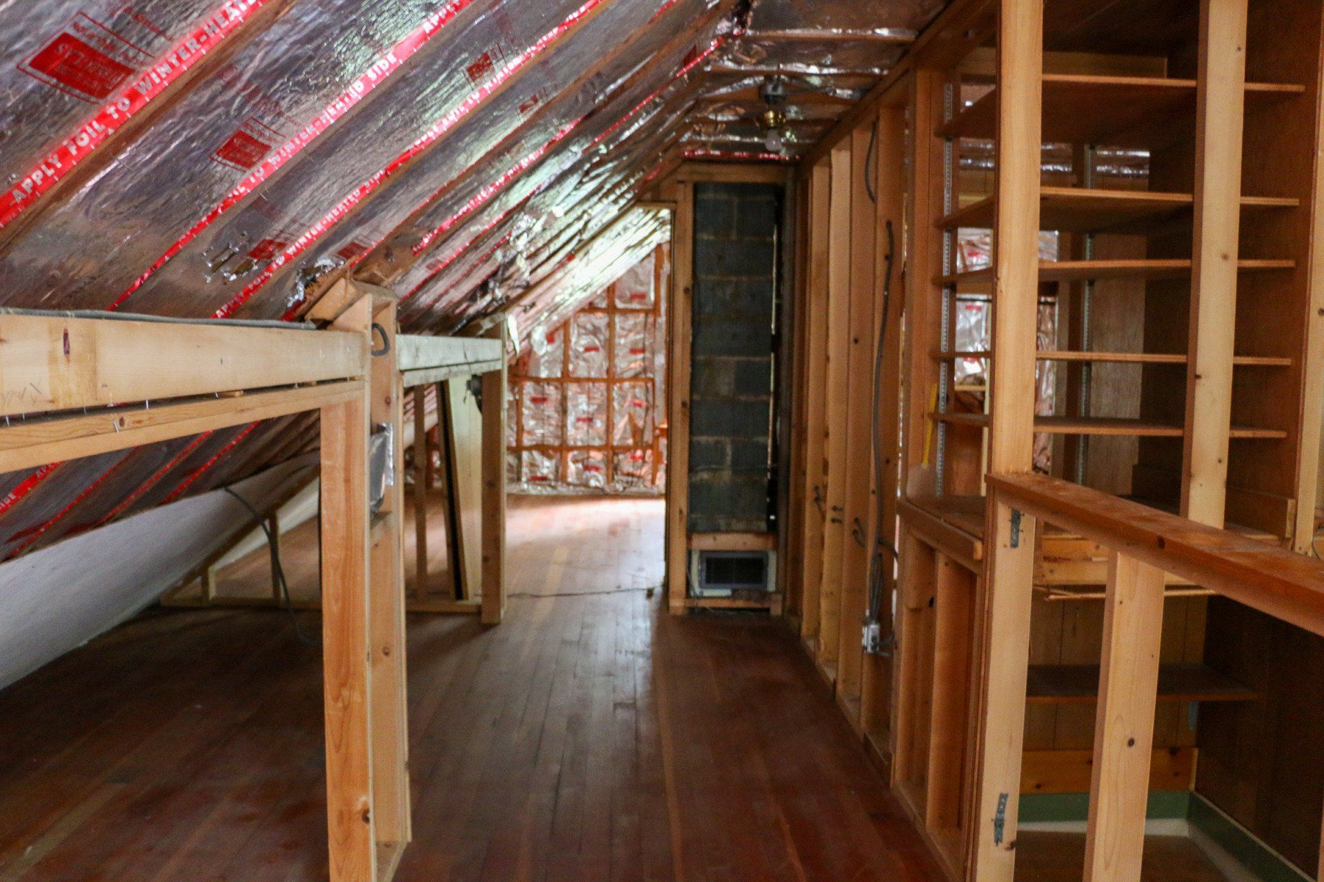 An attic under construction with a wooden floor