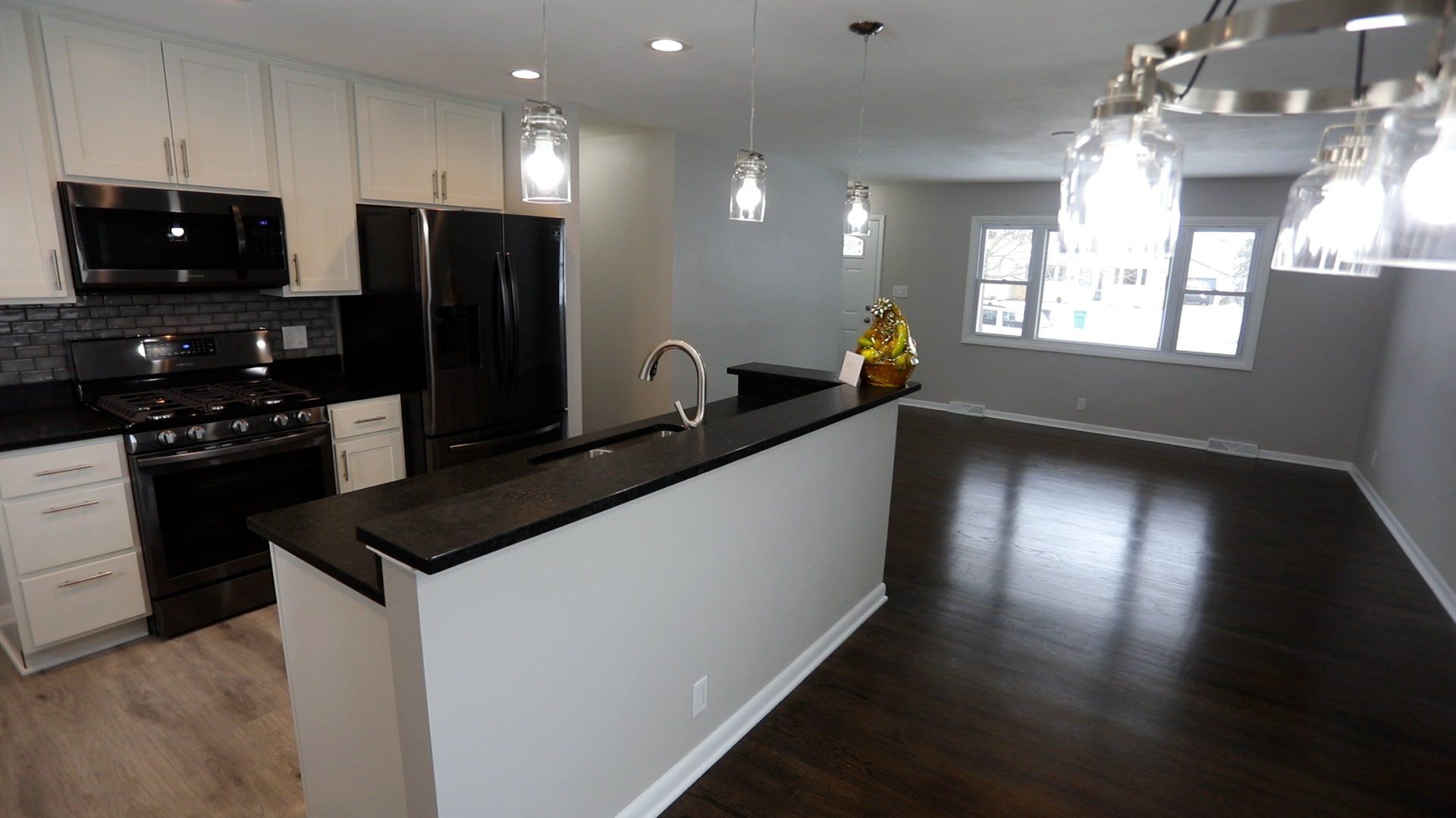 A kitchen with stainless steel appliances and granite counter tops