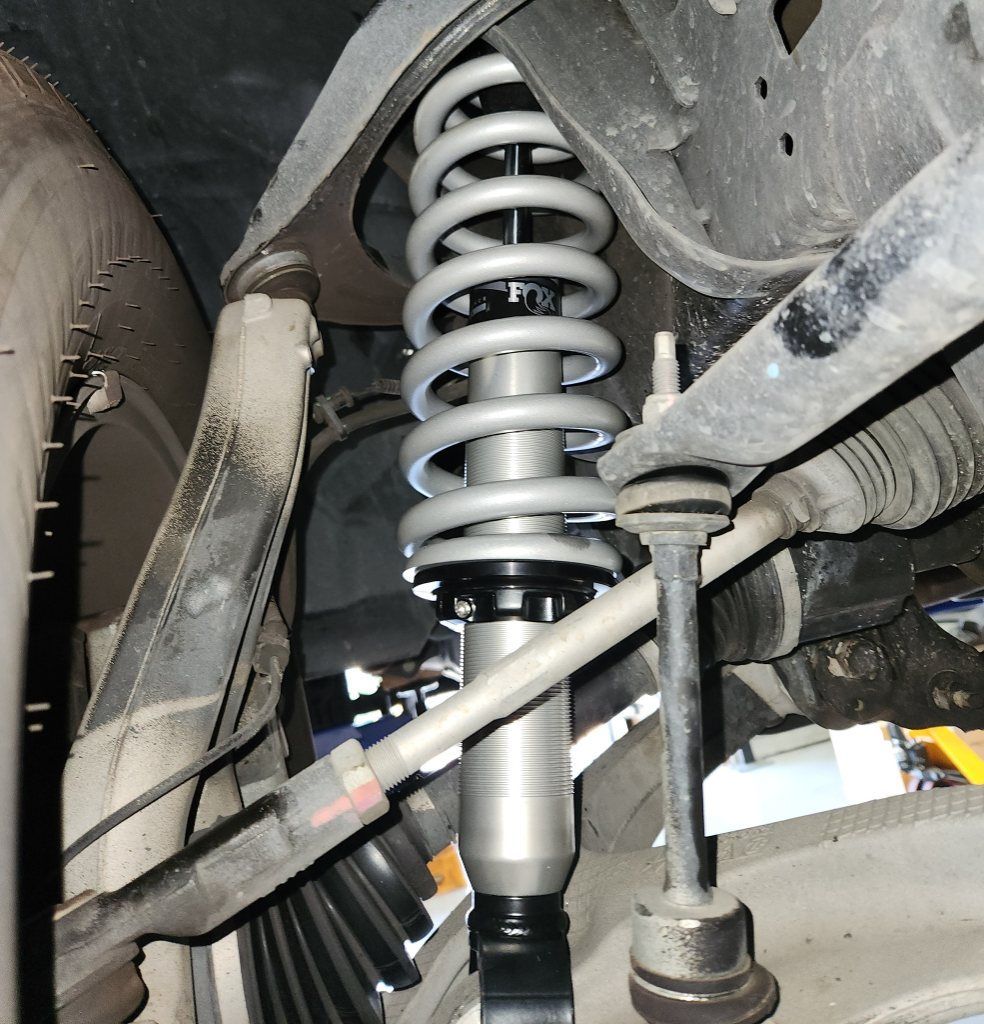 A Close Up of a Shock Absorber on a Car — Coasteer Automotive In Tuggerah, NSW