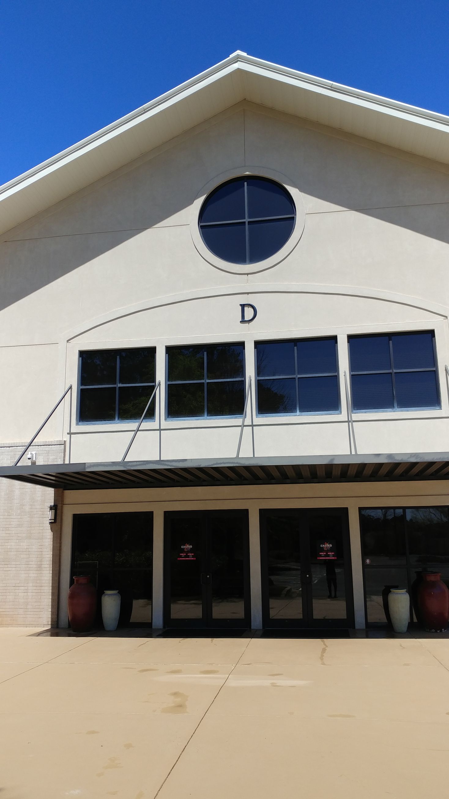 The front of a building with the letter d on it