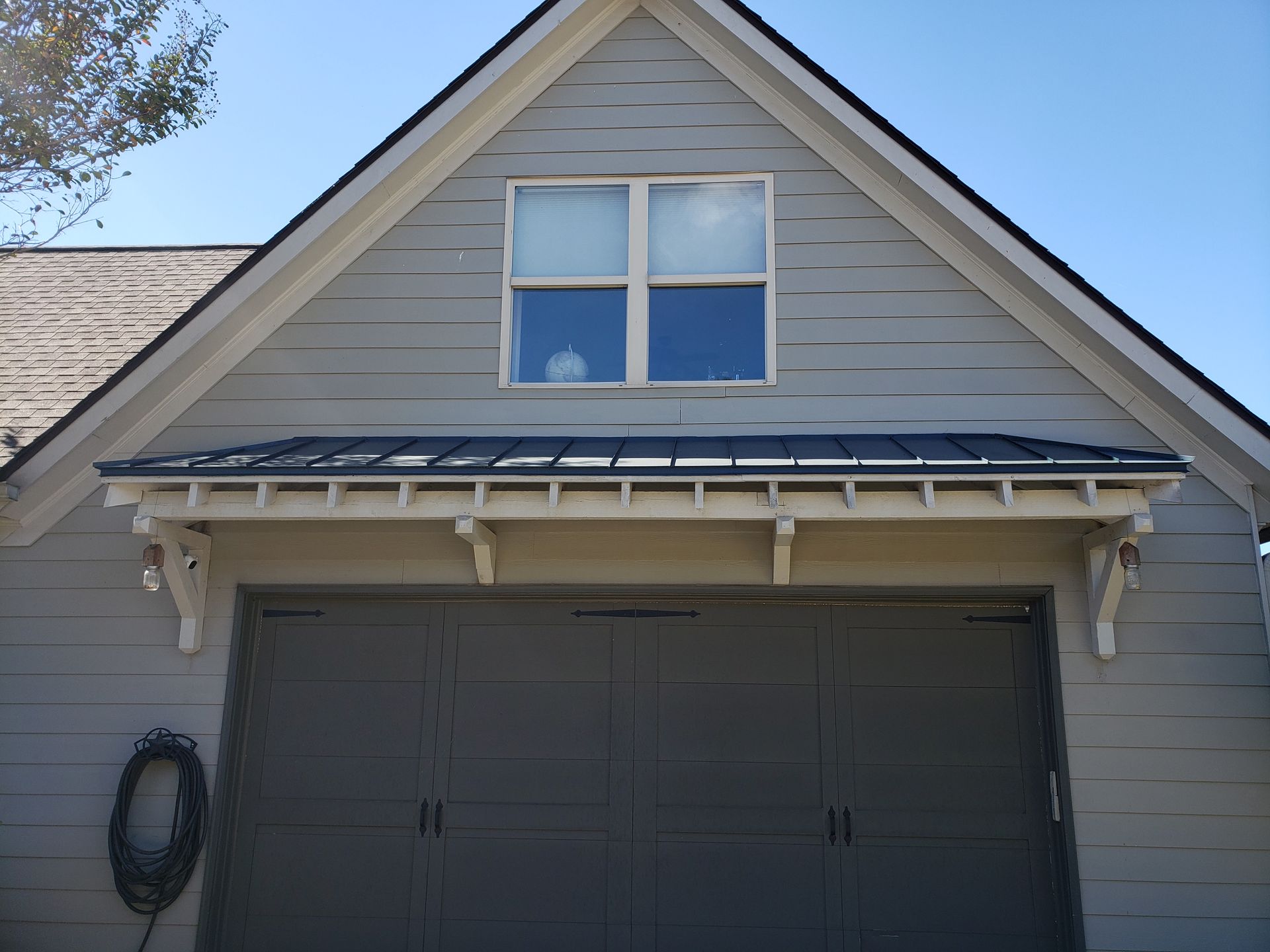 A garage with a window on top of it