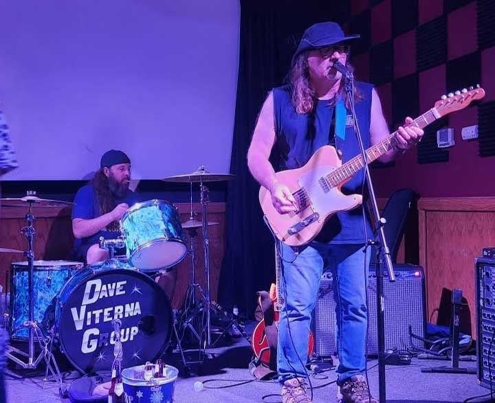 A band performs on stage.
