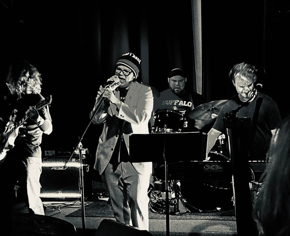 A band performs on stage.
