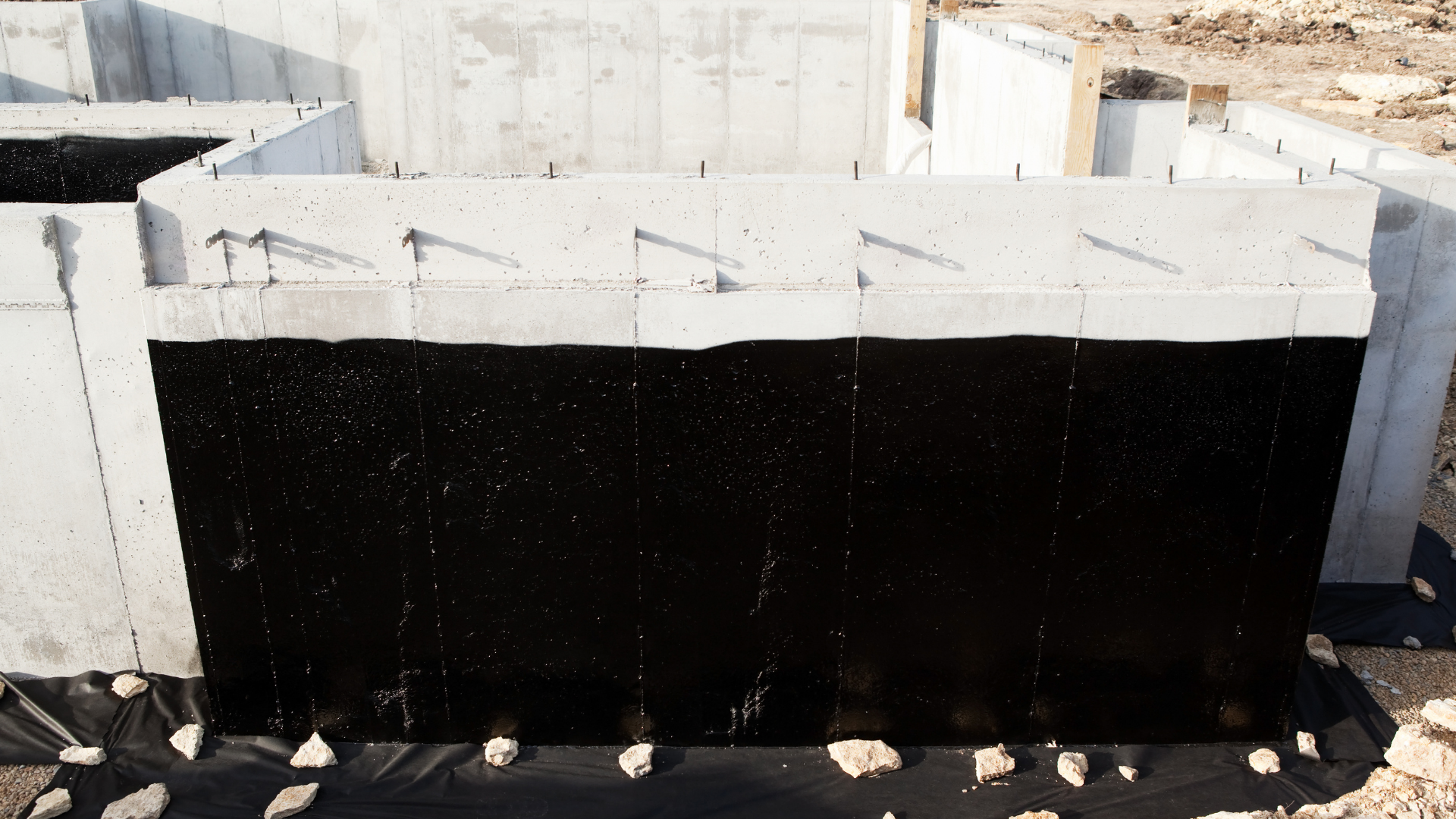 Drainage system setup with french drain near basement wall