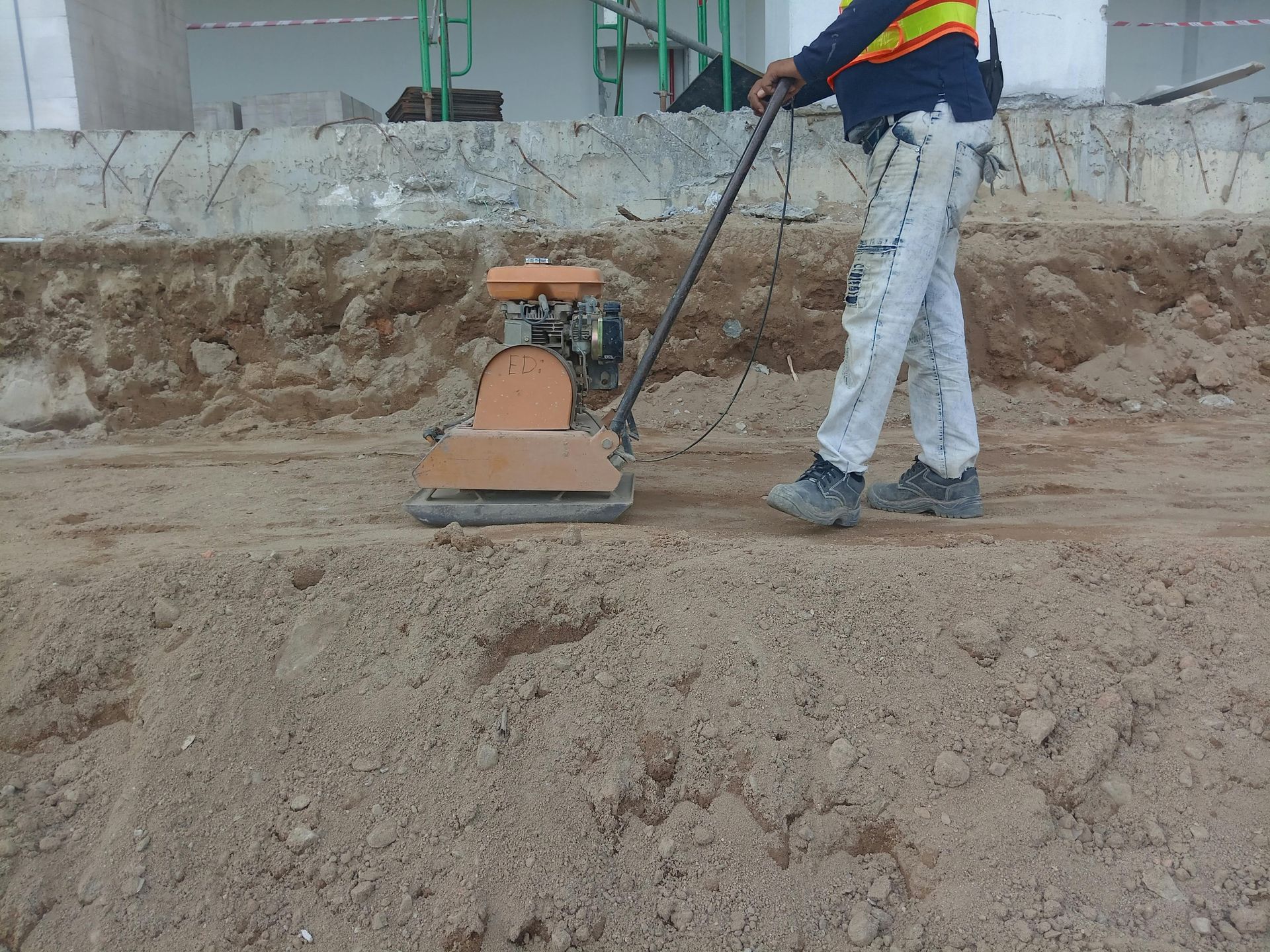 Concrete repair work fixing uneven and sunken driveway sections