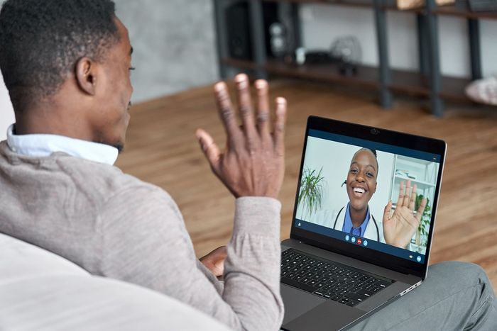 male black patient talking on conference