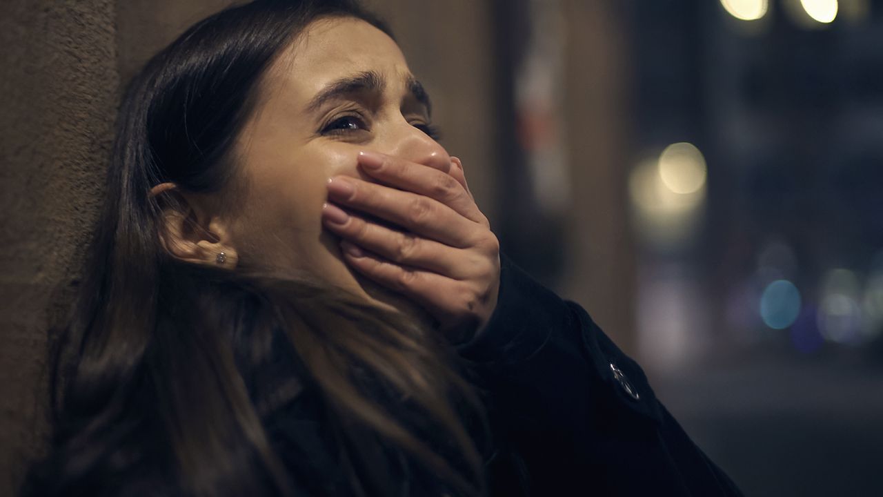 shocked robber victim crying night street