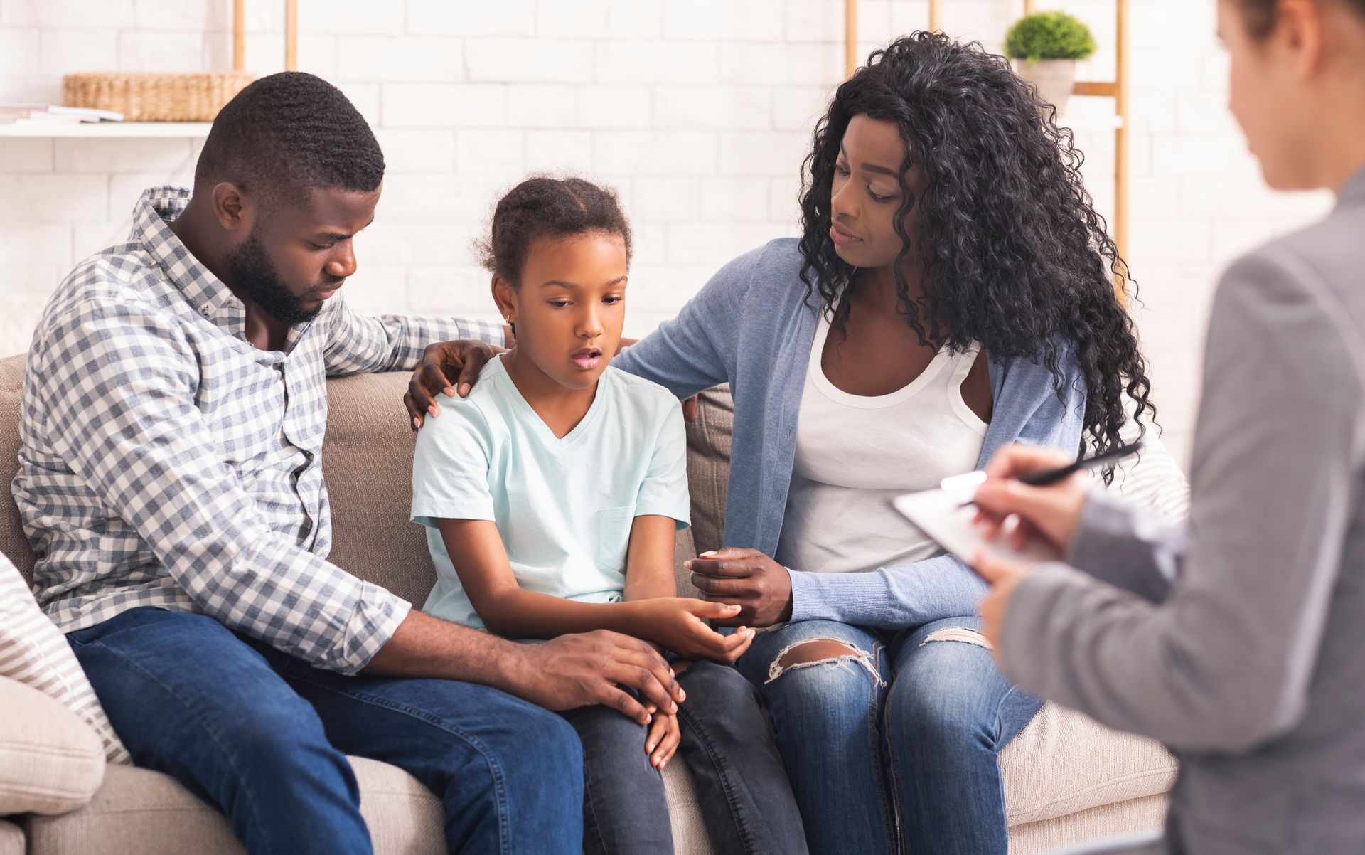 rear view female psychologist helping young