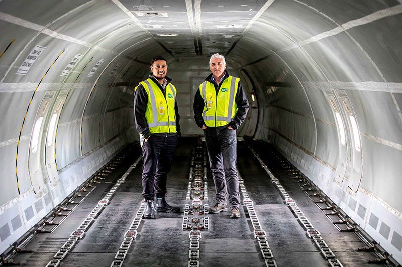 GO workers in cargo plane