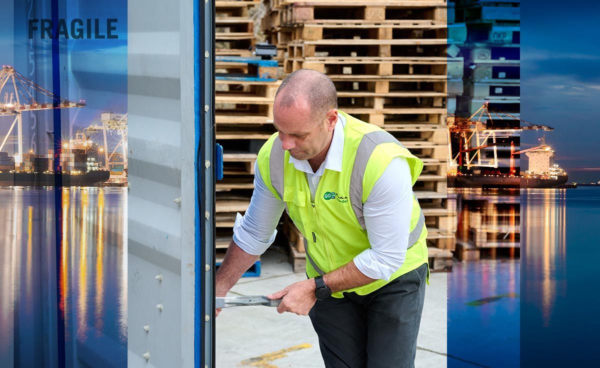GO worker at shipping container dock