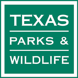 A green sign that says texas parks and wildlife
