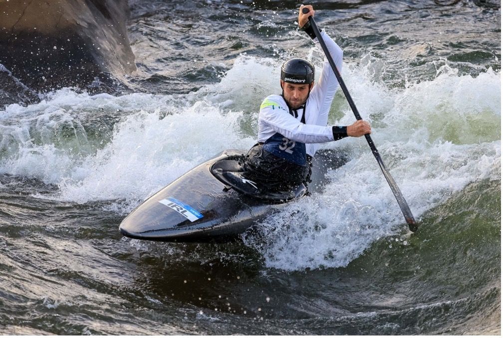 Paddle Northern Ireland | A man is paddling a kayak down a river.