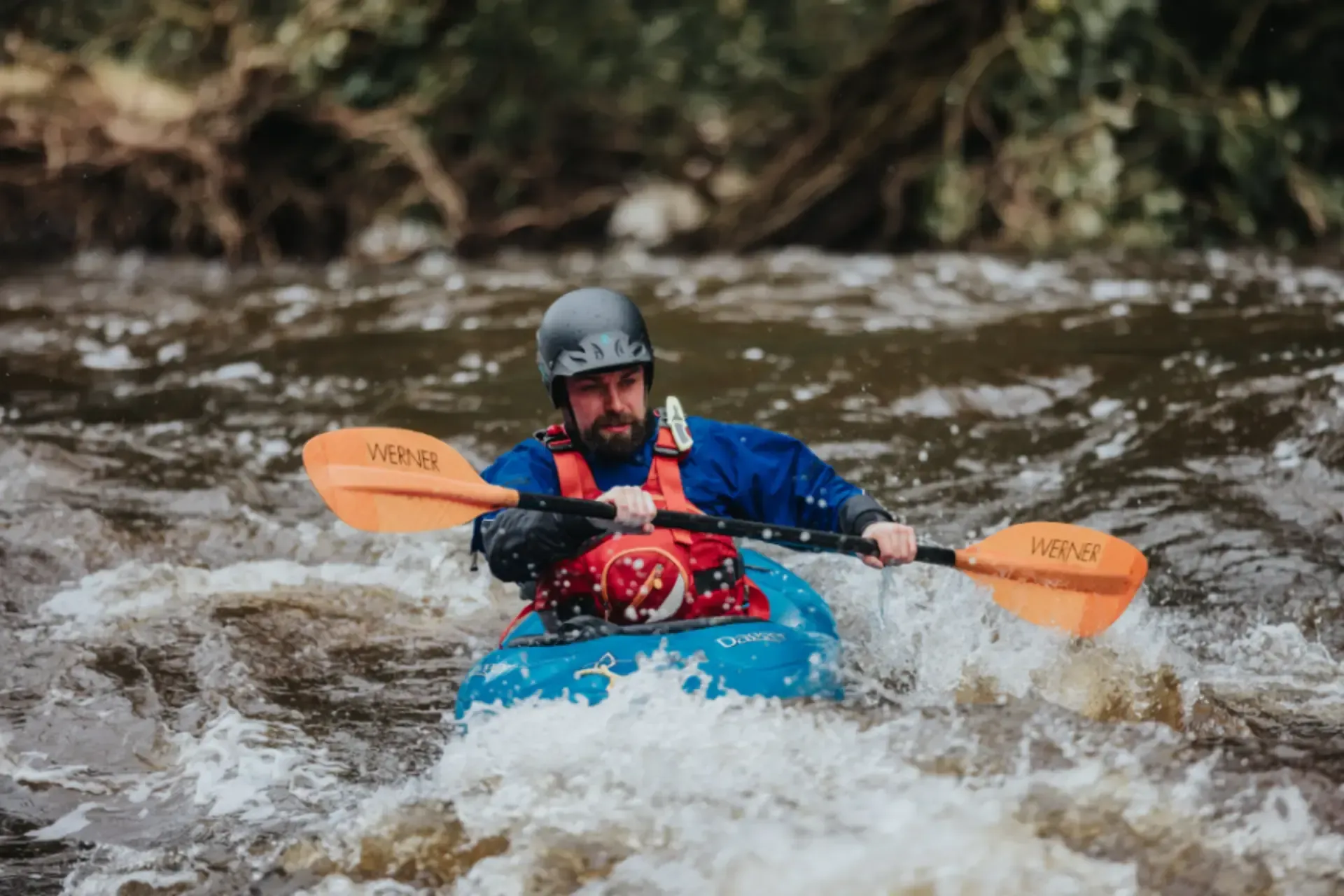 Paddler Northern Ireland | Two people in kayaks are going down a waterfall