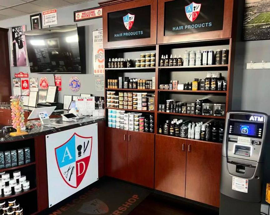 Small retail shop counter with shelves of CBD products and an ATM machine on the right