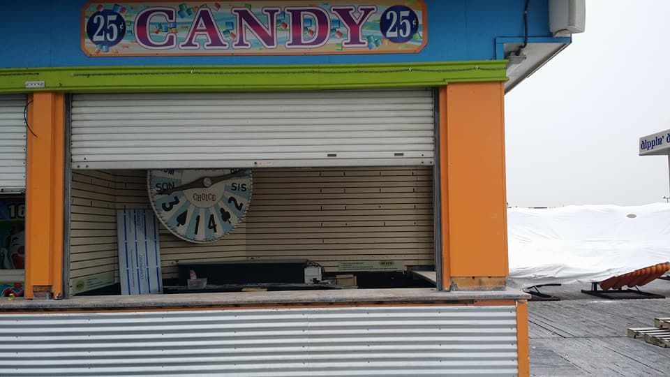 A colorful building with a sign that says candy 25 on it