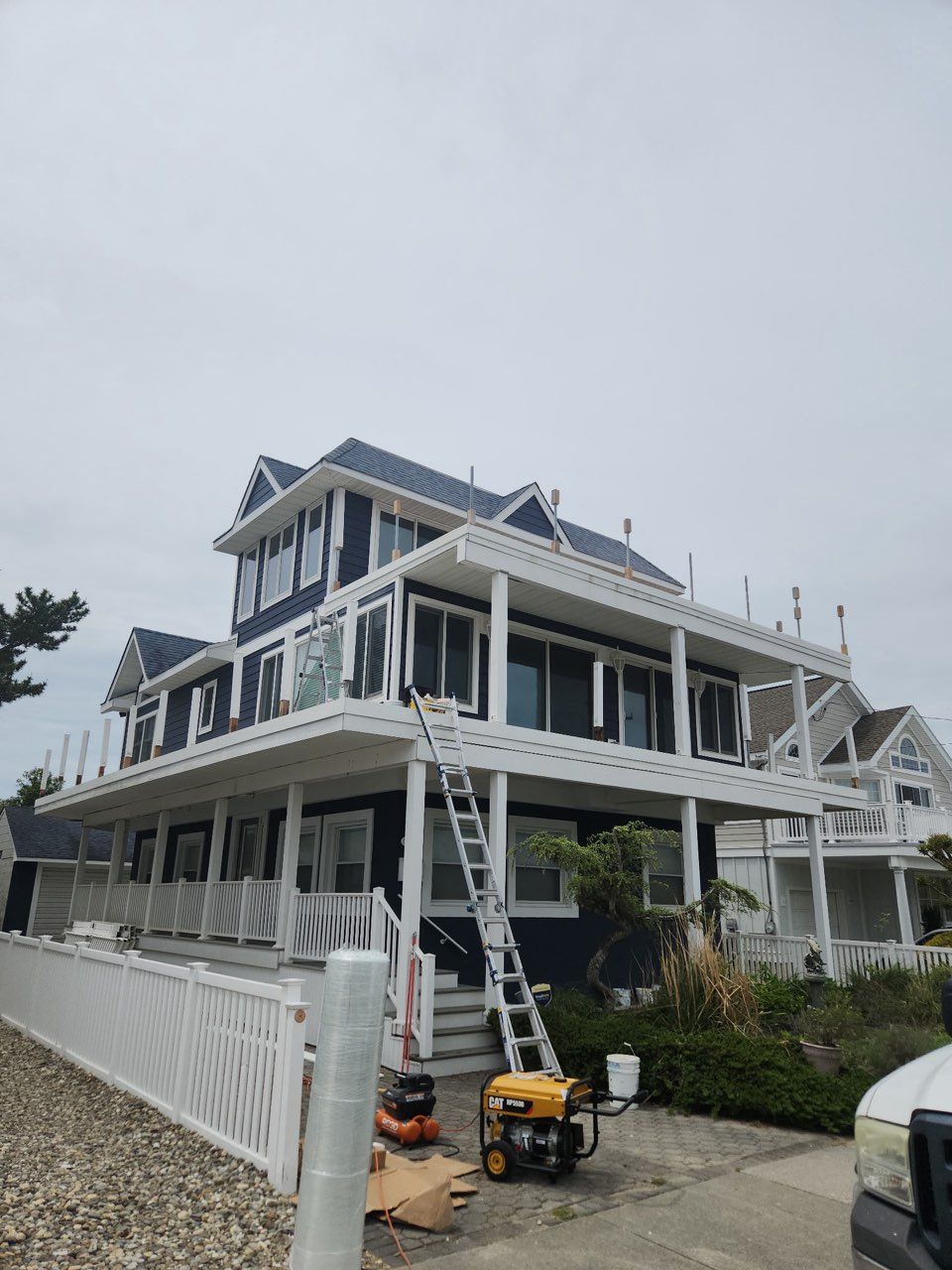 A large house with a generator in front of it