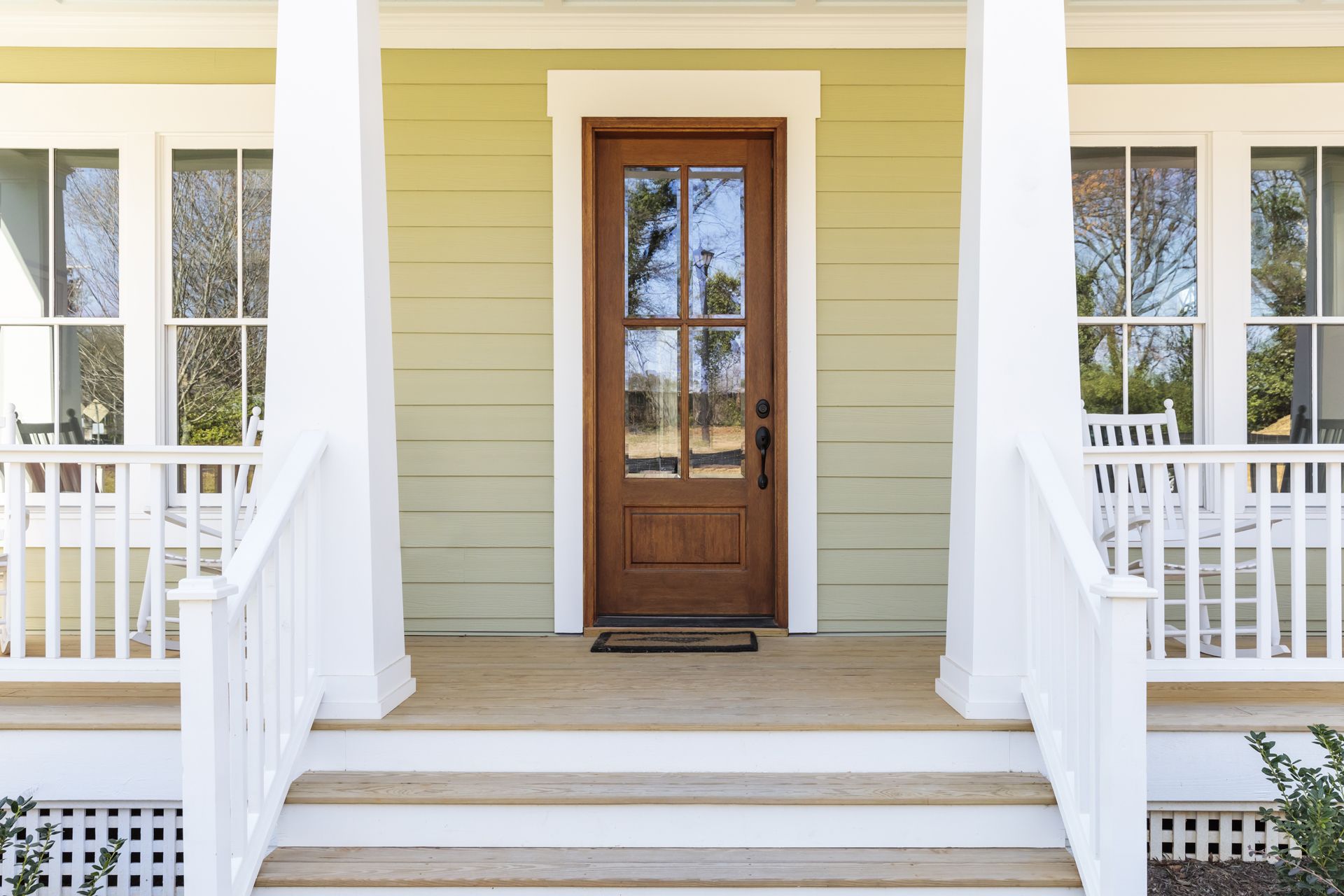 The Front Door of a House With Fiberglass Columns