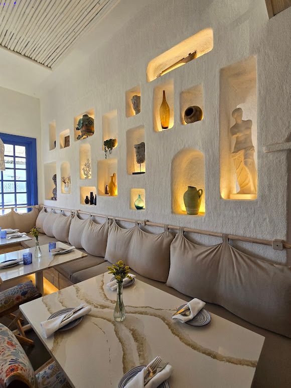 A man is using a trowel to spread concrete on a construction site.