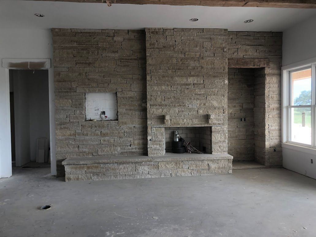 A brick wall is being built on a construction site