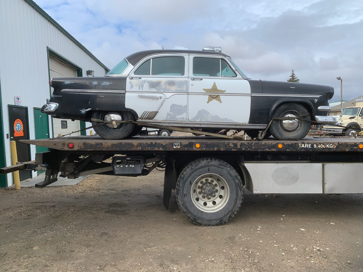 a run-down 1954 Cresline Police Car