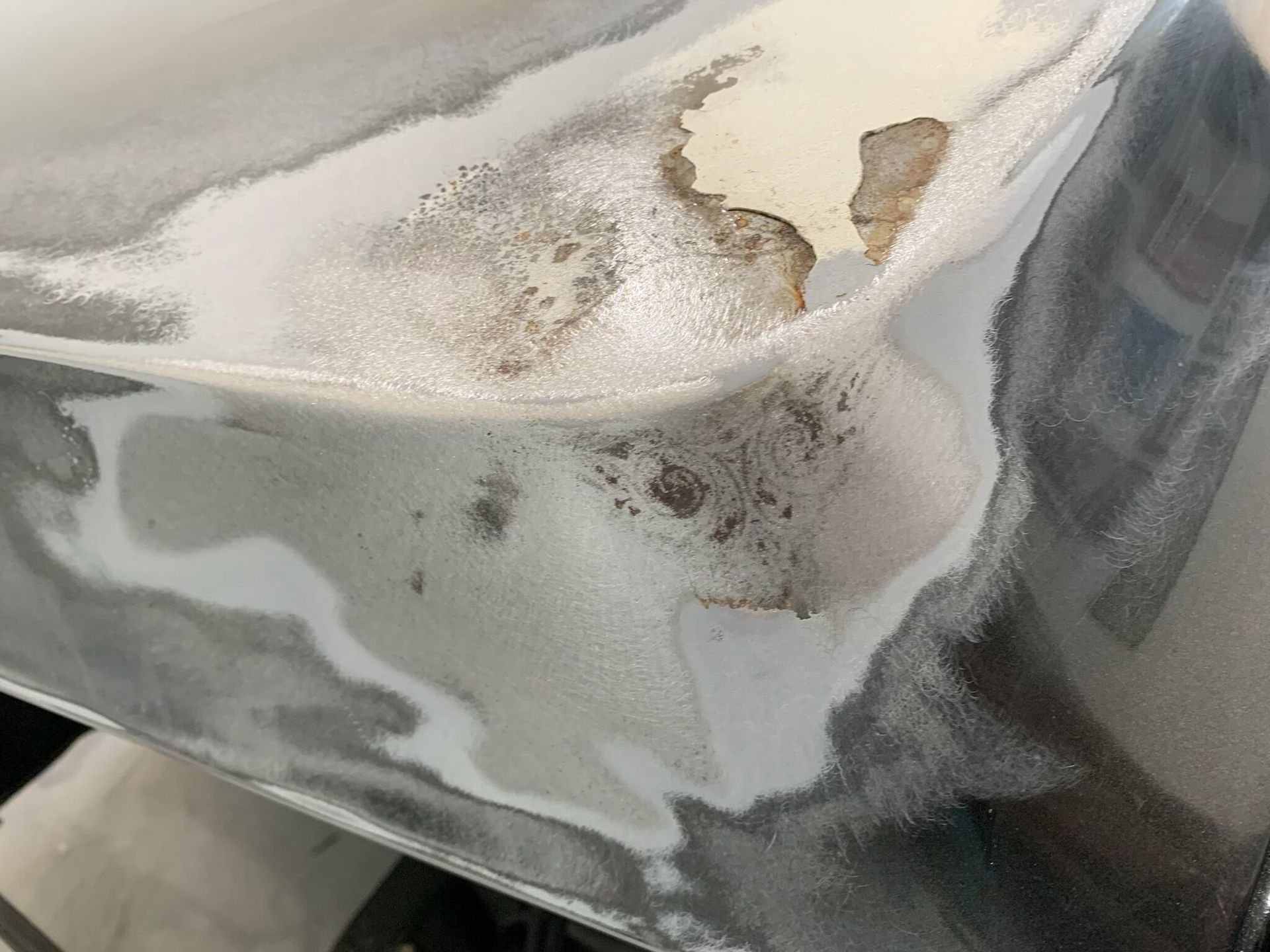 A close up of a piece of metal with a hole in it.