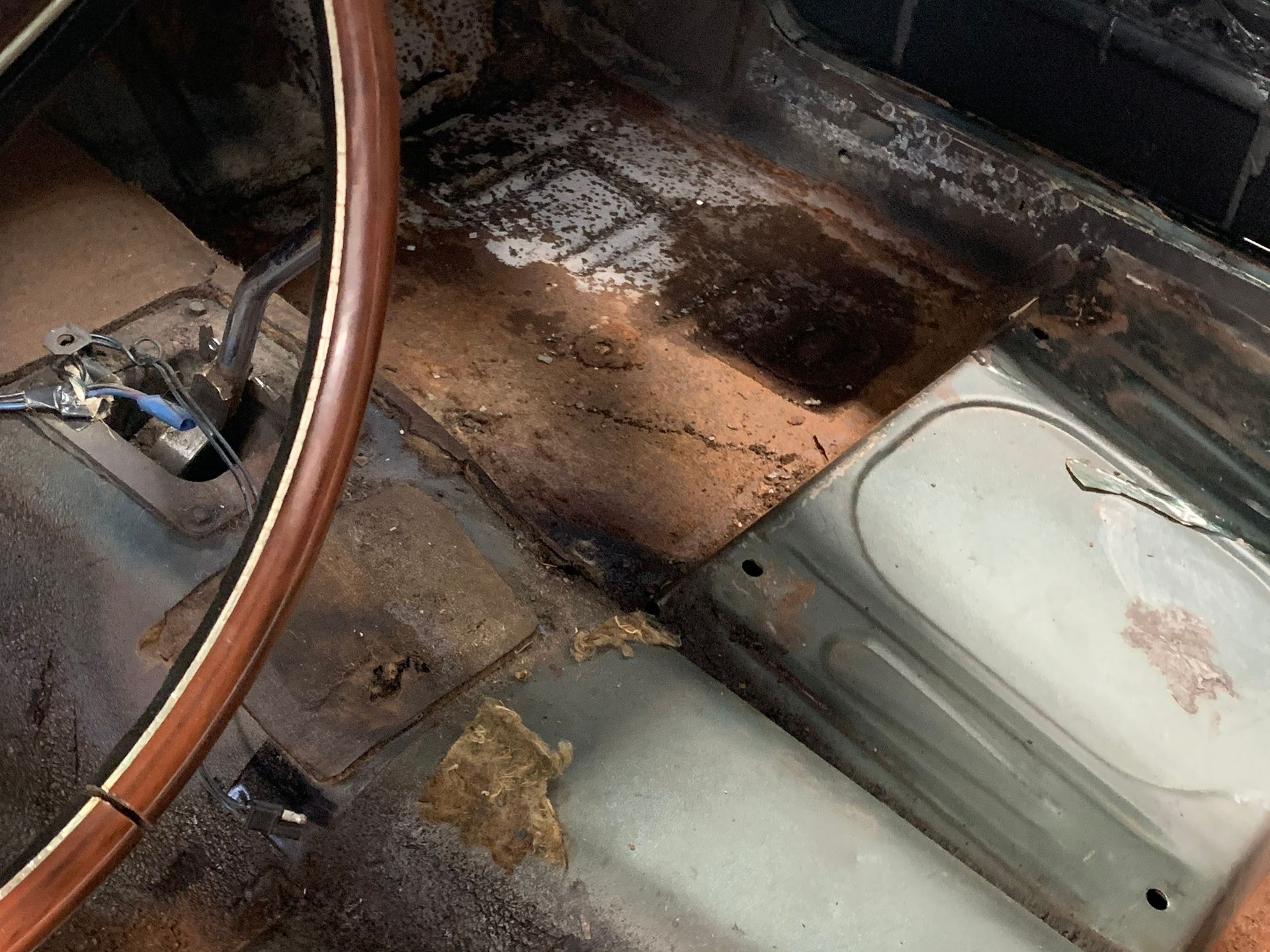 A close up of a steering wheel in a car