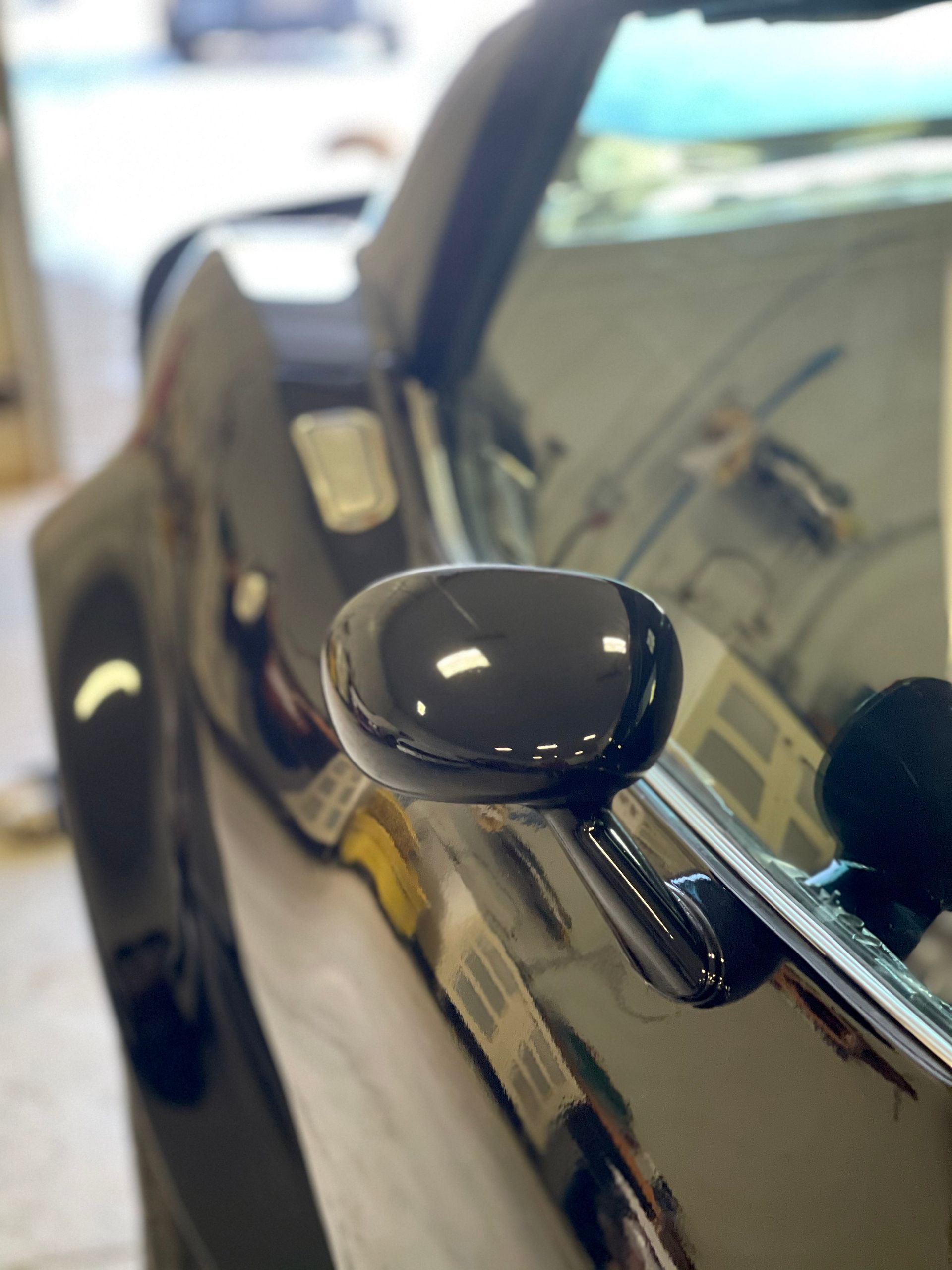 A close up of a car 's side view mirror