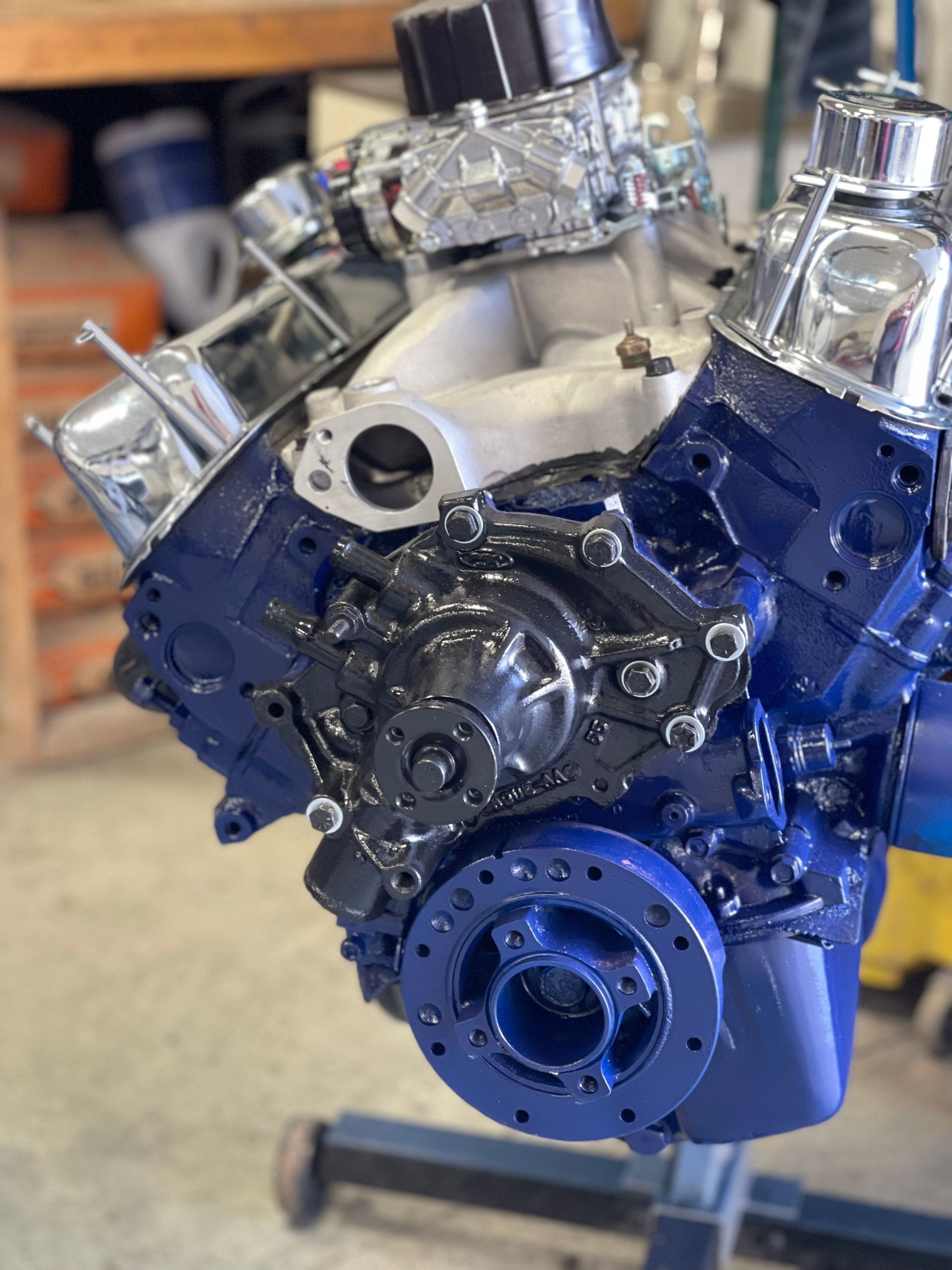 A blue and black engine is sitting on a table.