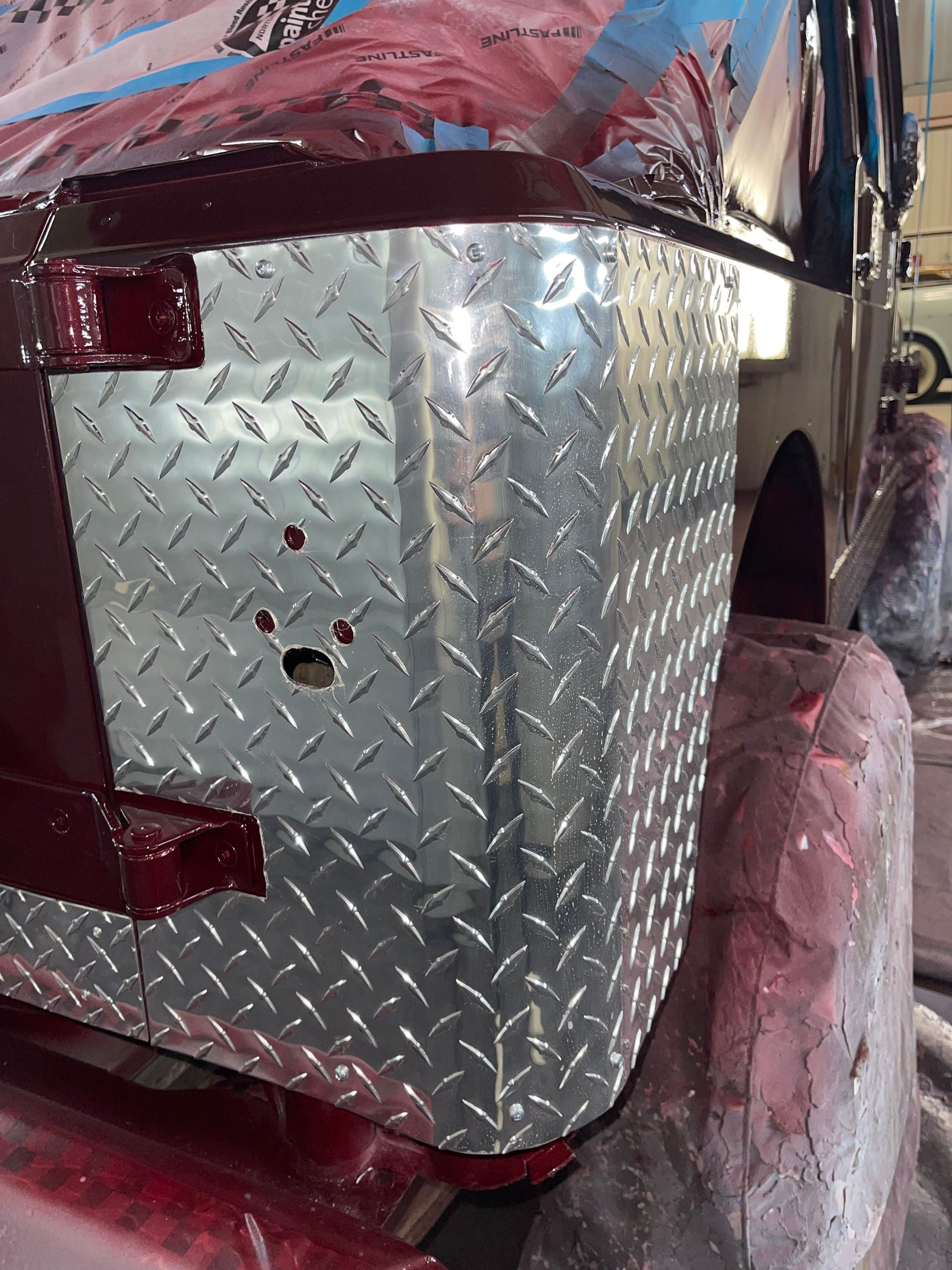 A close up of a diamond plate on a vehicle