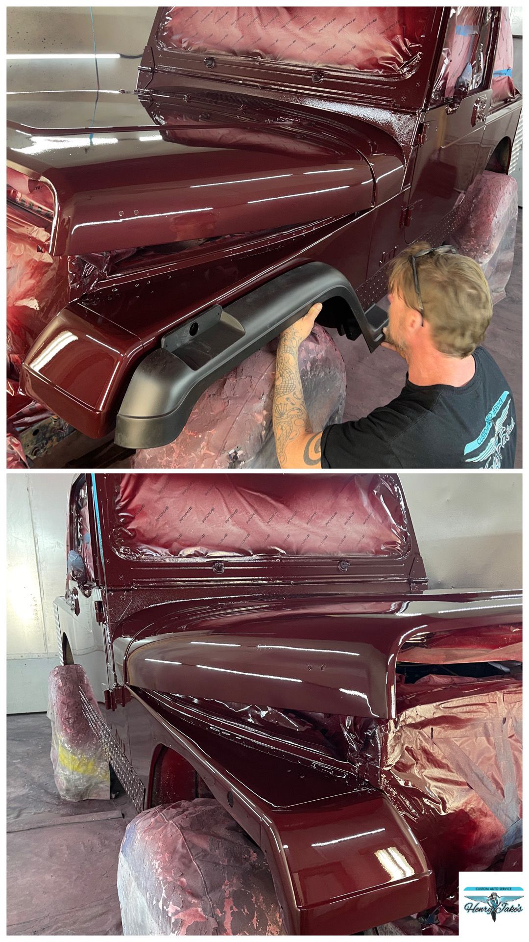 A man is painting the fender of a red jeep.