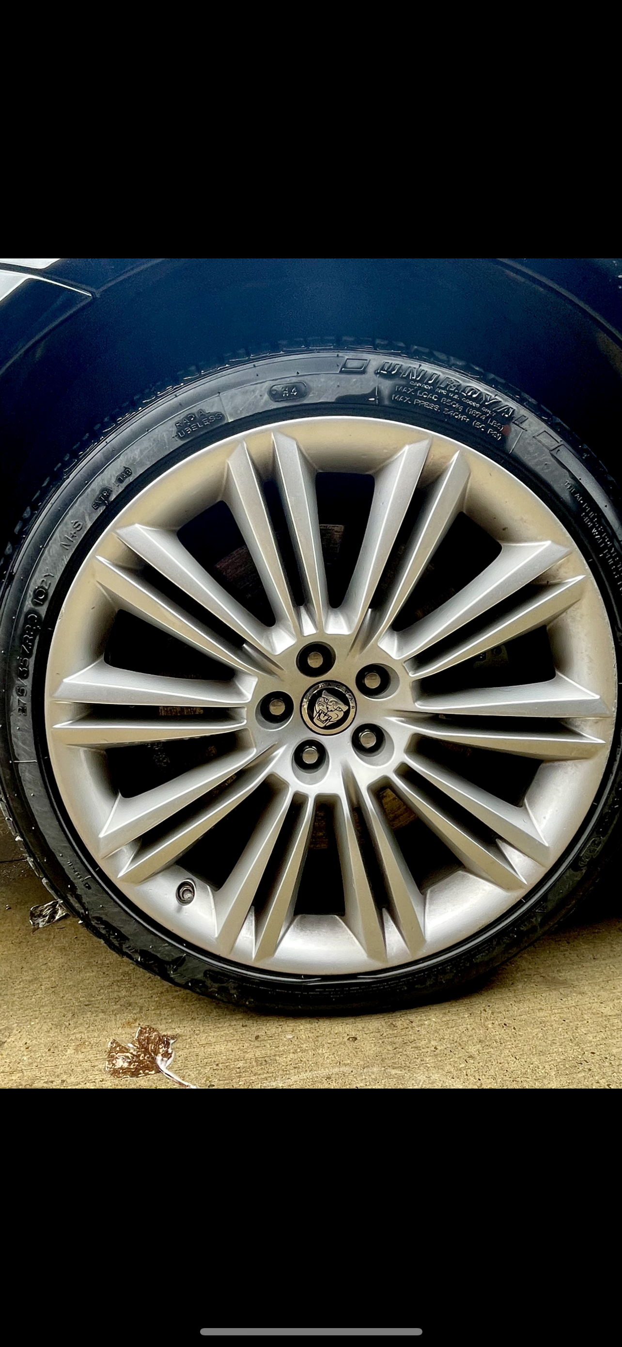 A close up of a car wheel with a tire on it.