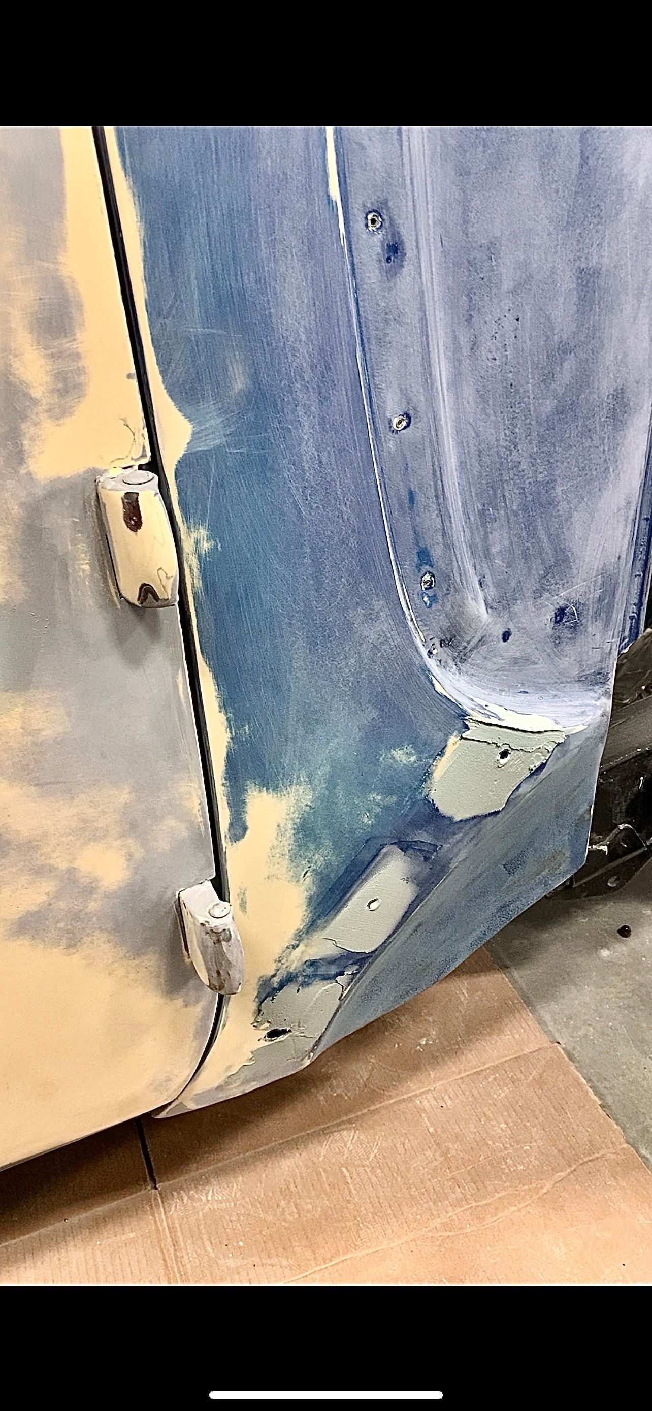 A close up of a blue and white painting on a wall.