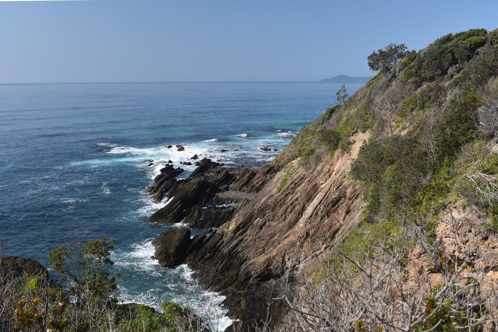 Cliff Overlooking the Ocean with Waves — Fletcher's Truck and 4WD Repair Centre in Hallidays Point, NSW