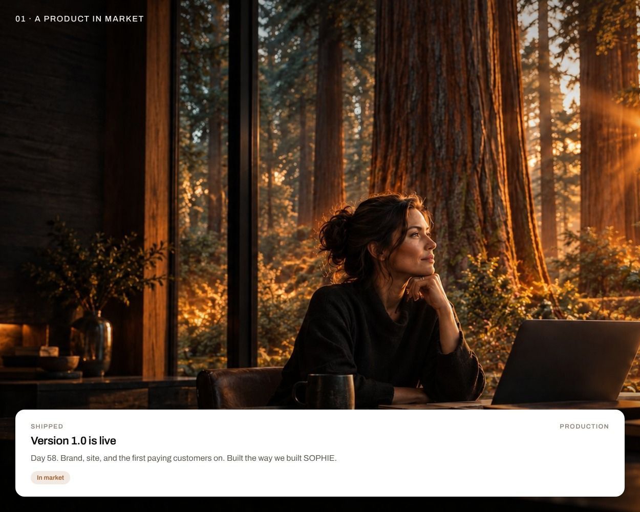 A founder at her desk in warm light, redwoods behind her, with a card reading 