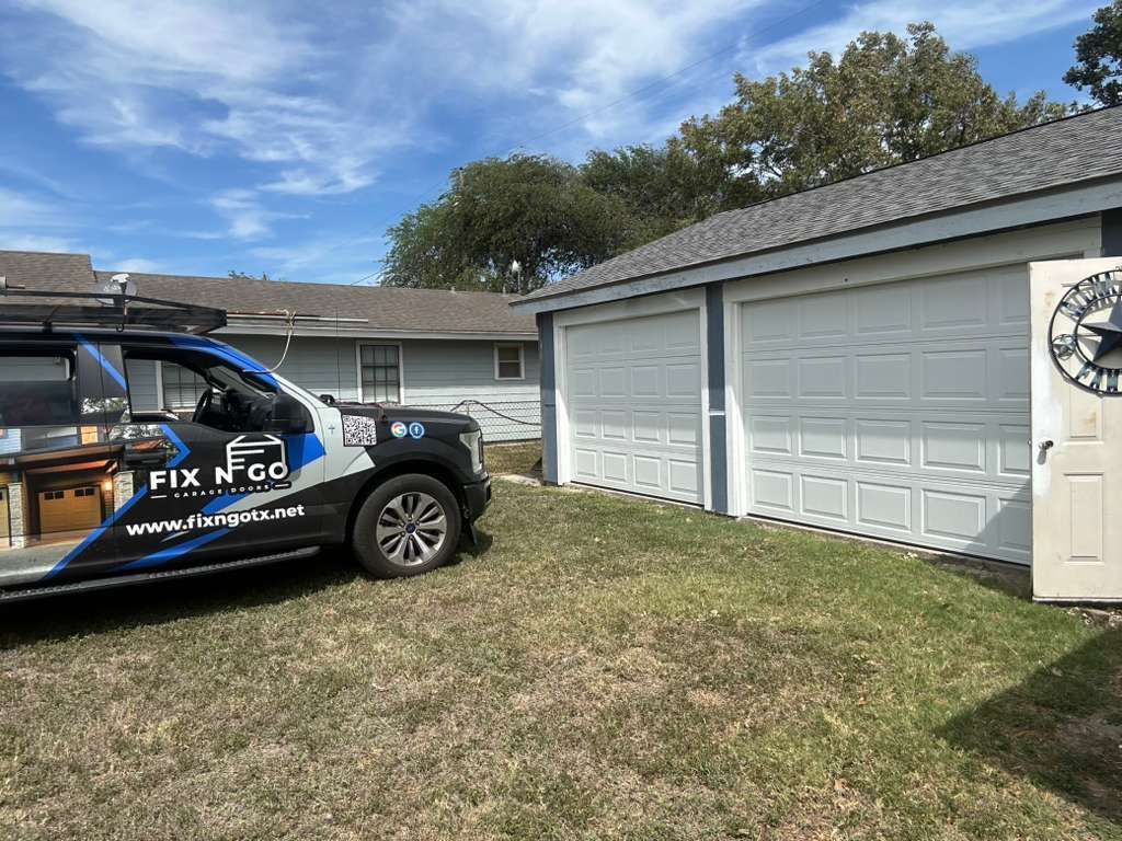 Fix N Go service truck parked at a Corpus Christi home for garage door replacement