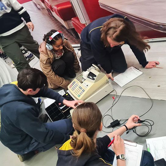 students gathering evidence in a Crime Story crime scene workshop