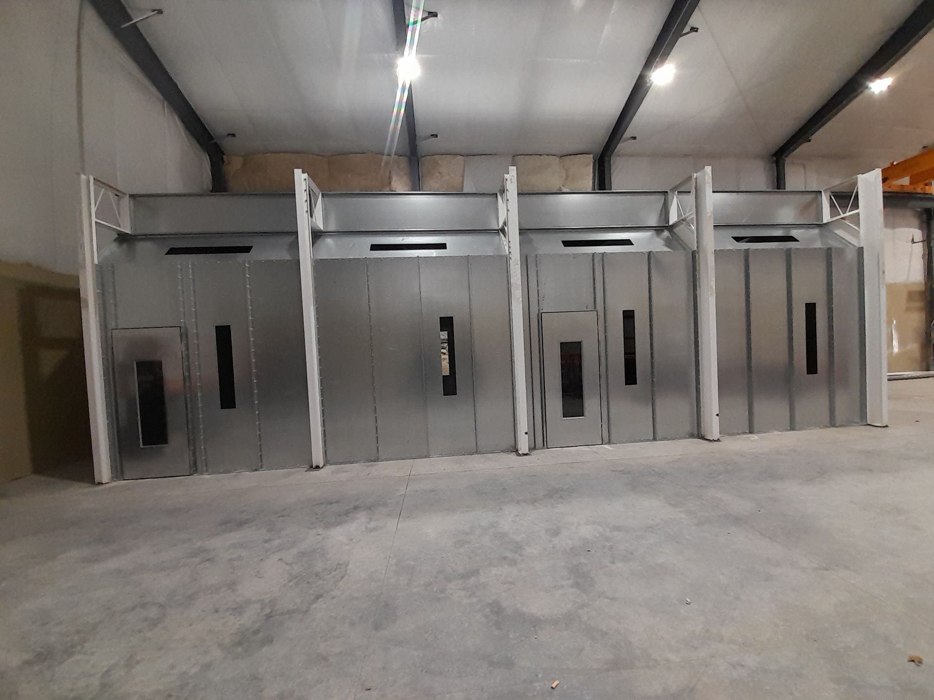A large room with a lot of doors and a ceiling