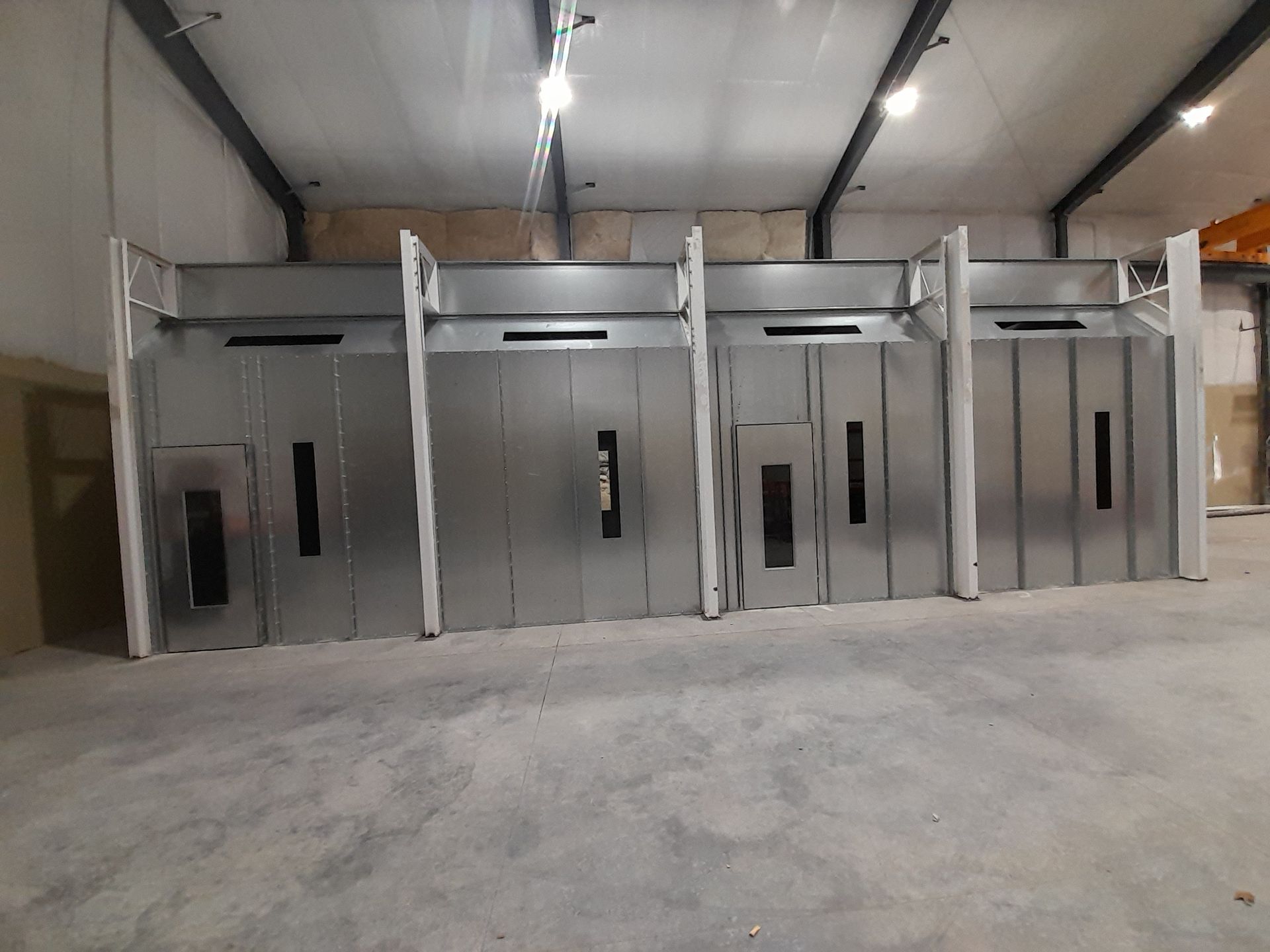 A large room with a lot of metal doors