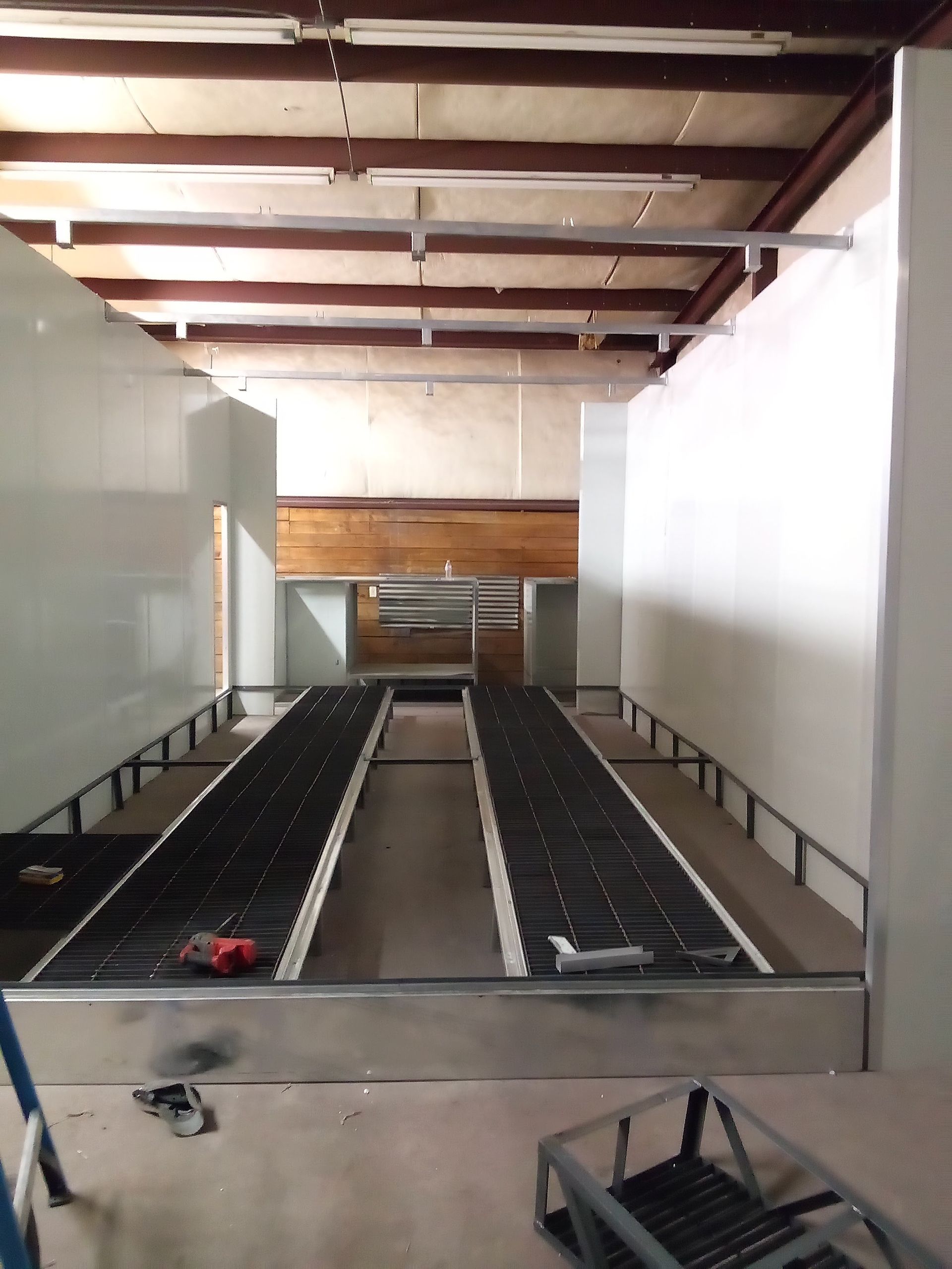 An empty room with a conveyor belt going through it