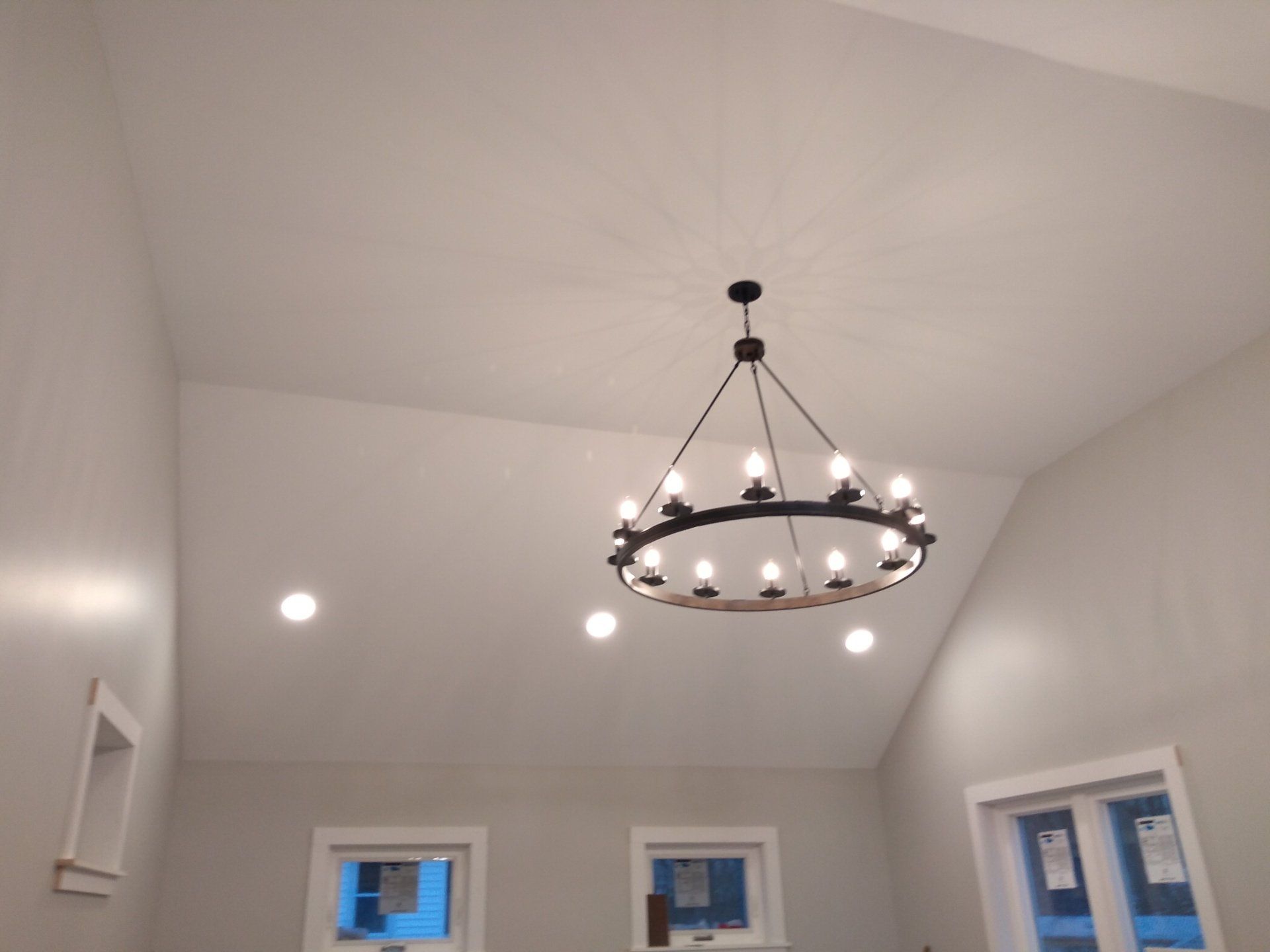 a chandelier hanging from the ceiling of a room