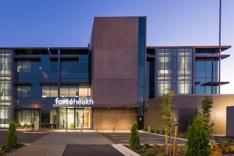 A large building with a sign that says fortehealth