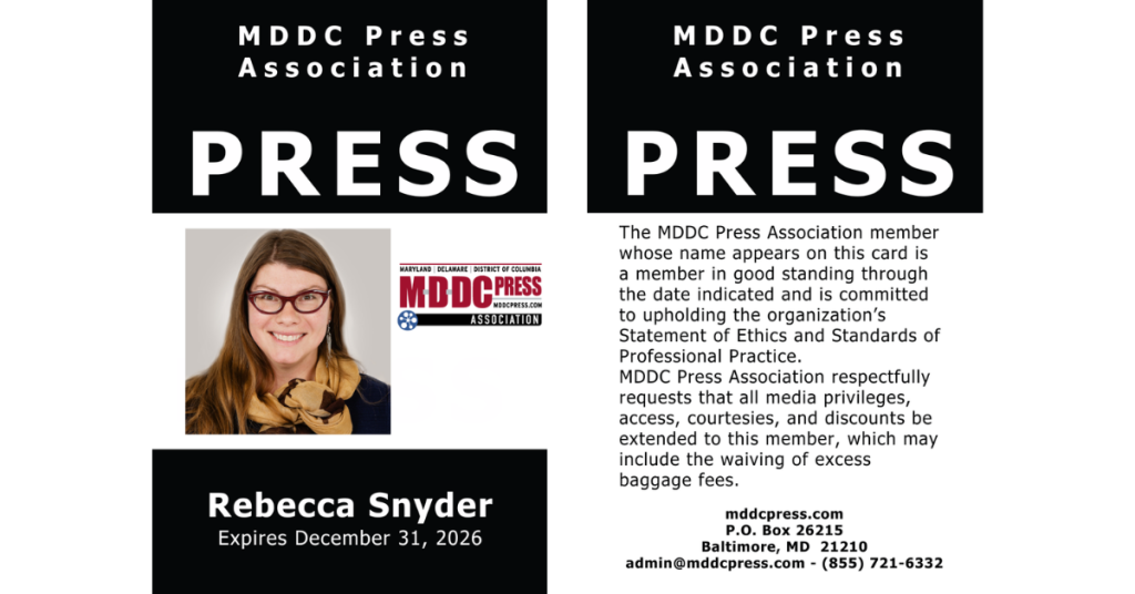MDDC Press Association press badge for Rebecca Snyder, expiring December 31, 2026, with a photo and verification text.
