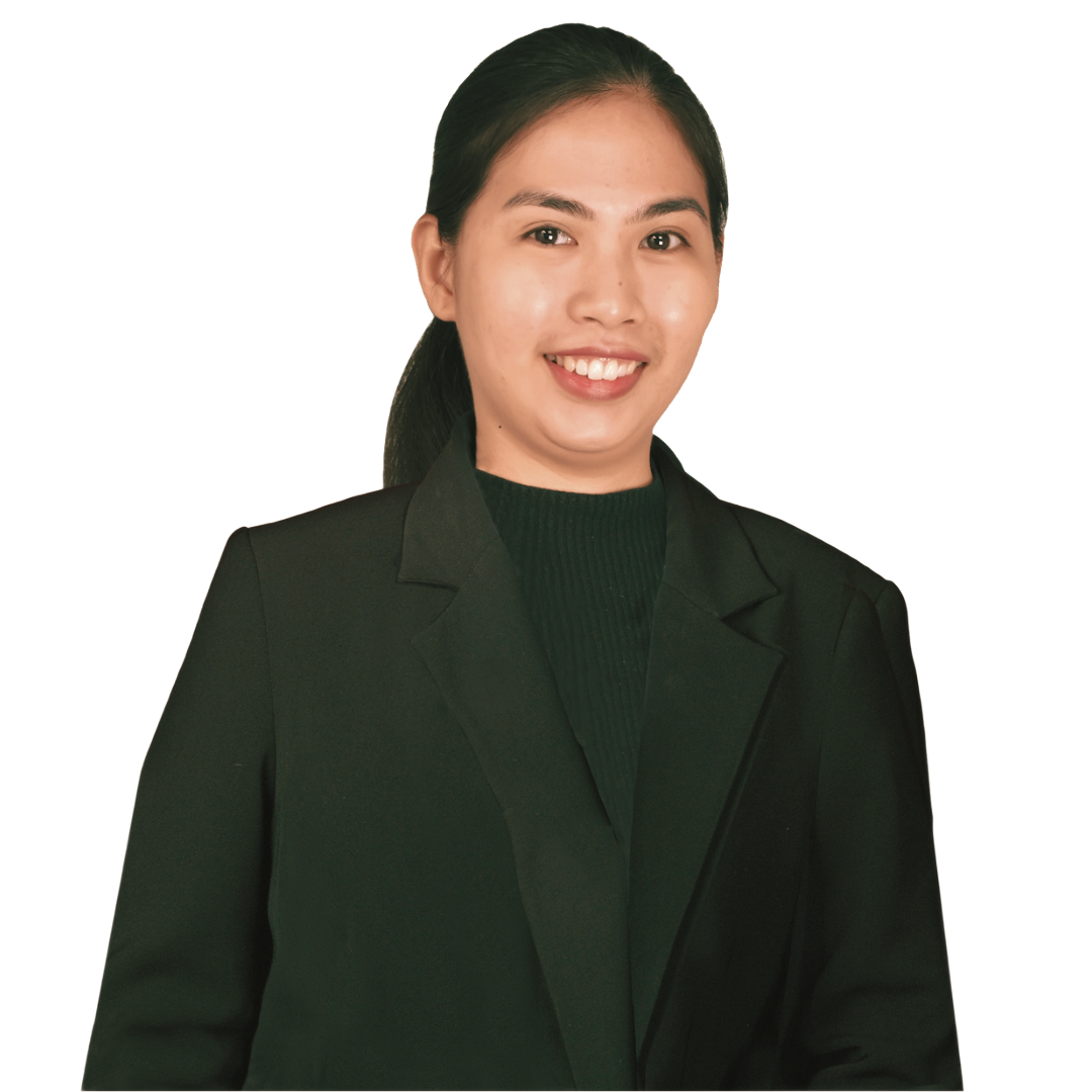 A person smiling while wearing a dark blazer over a dark sweater, set against a plain, light background.