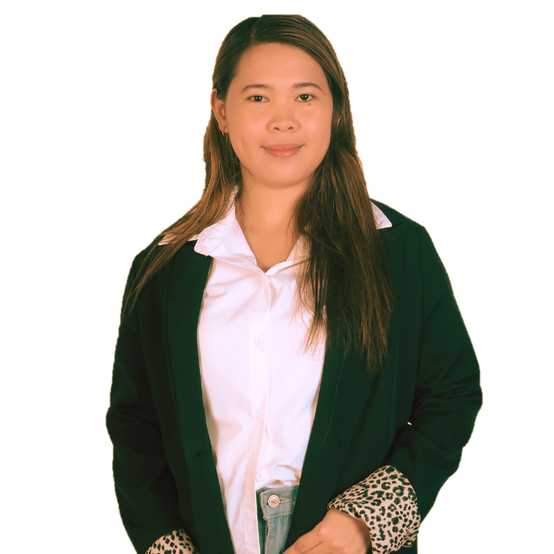 A person with long brown hair, wearing a white shirt and dark jacket with leopard-print cuffs, posing against a white back.