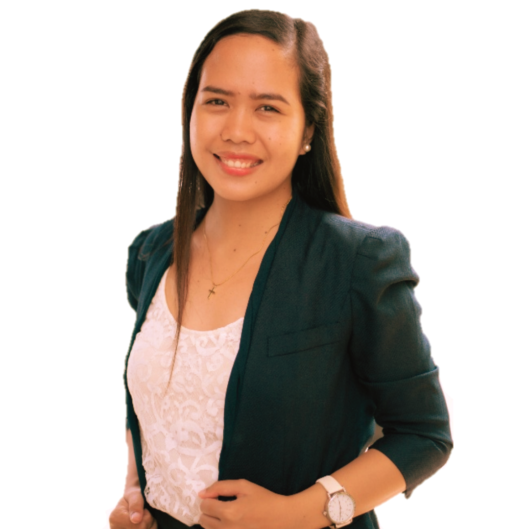 A smiling professional wearing a white lace top under a dark green blazer with a white watch on her left wrist.