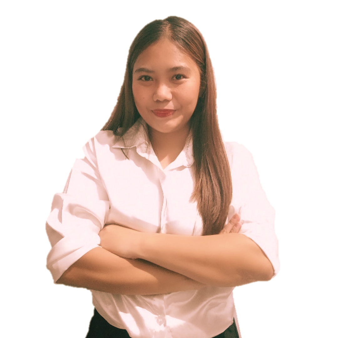A person with long brown hair, wearing a white button-down shirt, stands with arms crossed against a plain white background.